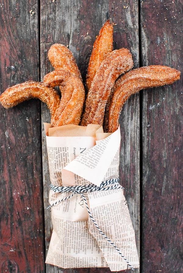 Churros wrapped in newspaper