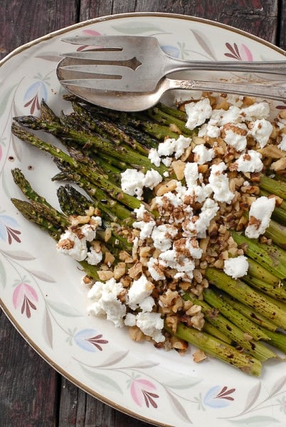 Roasted Balsamic Asparagus with Goat Cheese and Toasted Walnuts - on serving plate