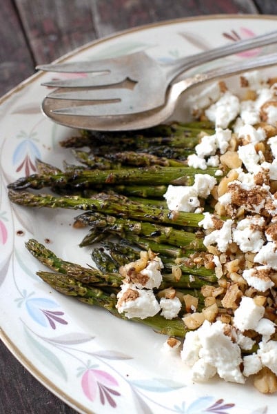 Roasted Balsamic Asparagus with Goat Cheese and Toasted Walnuts on platter