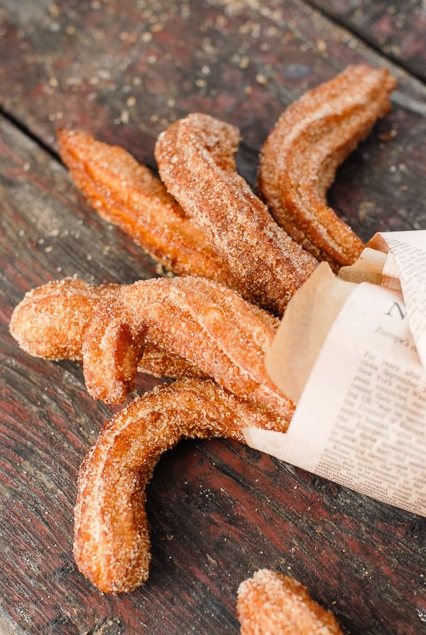 curly churros in newspaper