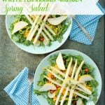 A bowl of salad on a plate, with Lemon