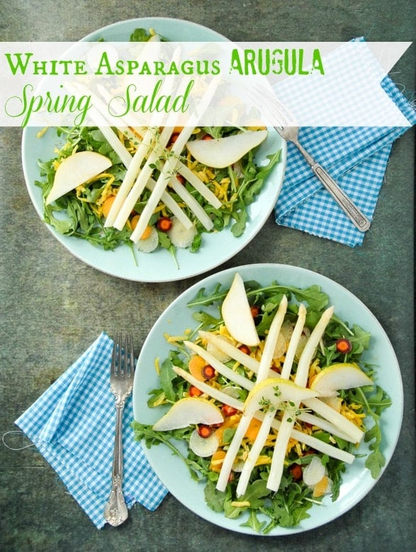 A bowl of salad on a plate, with Lemon