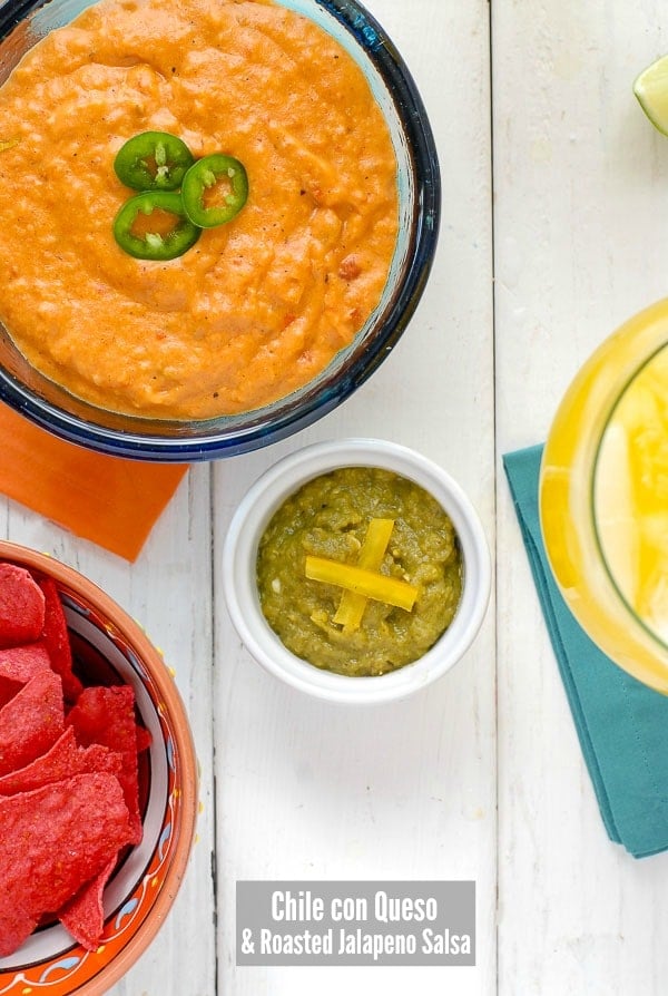Chile con Queso and Roasted Jalapeno Salsa with red tortilla chips (party dips)