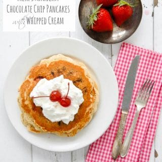 Fresh Strawberry Chocolate Chip Pancakes with Whipped Cream and maraschino cherries - titled photo