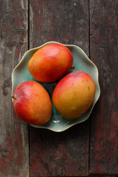 Mangos on blue plate