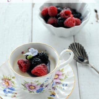 Teacup Panna Cotta with Berries in Creme de Violette syrup side view