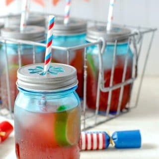 Firecracker Punch (Fourth of July punch recipe) in blue jars with straws