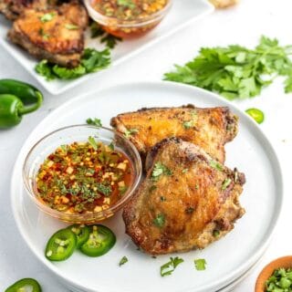 GRILLED CHICKEN THIGHS with dipping sauce and recipe title text