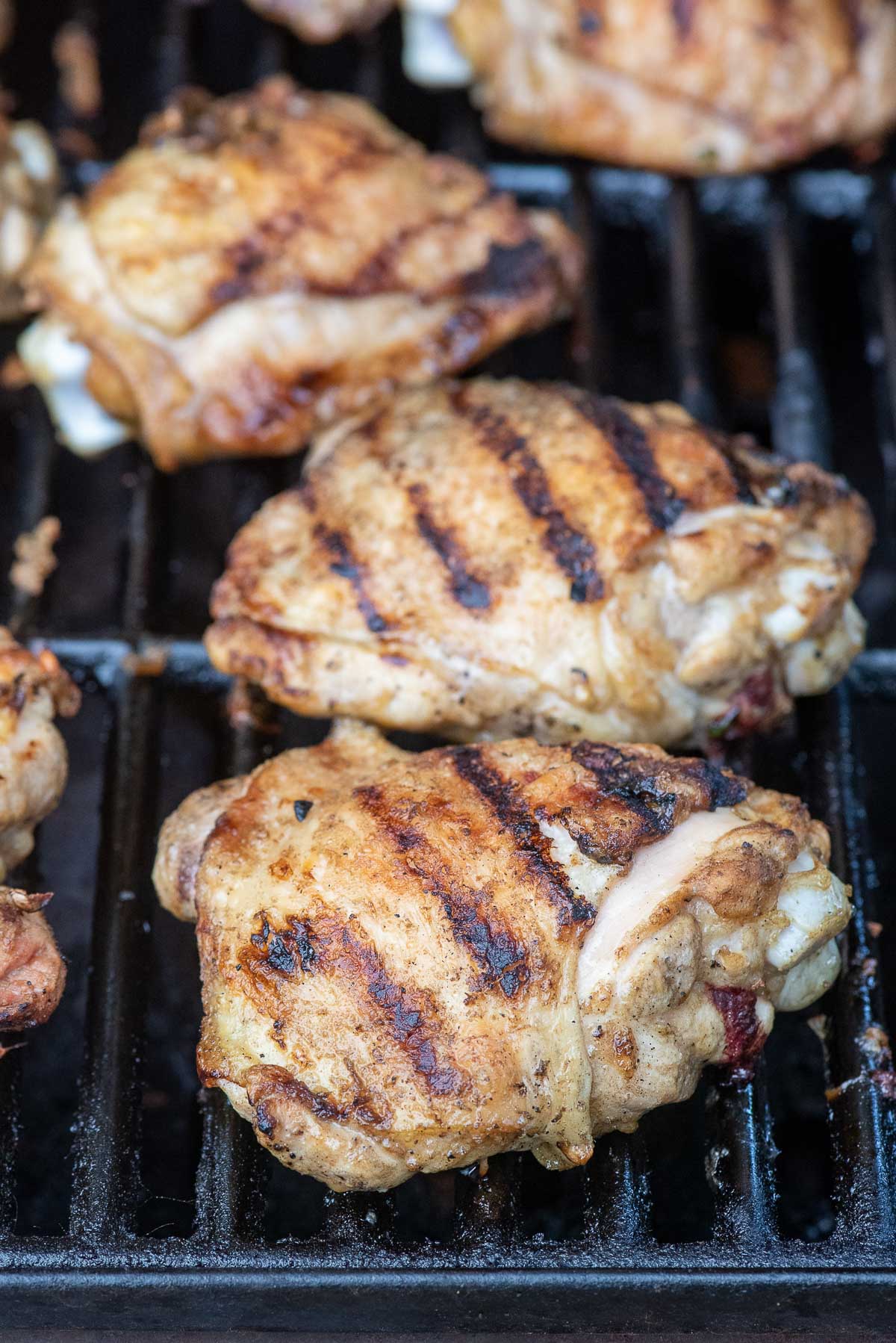 grilled chicken thigh on grill 