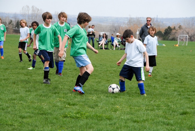 A group of young men playing a game of football