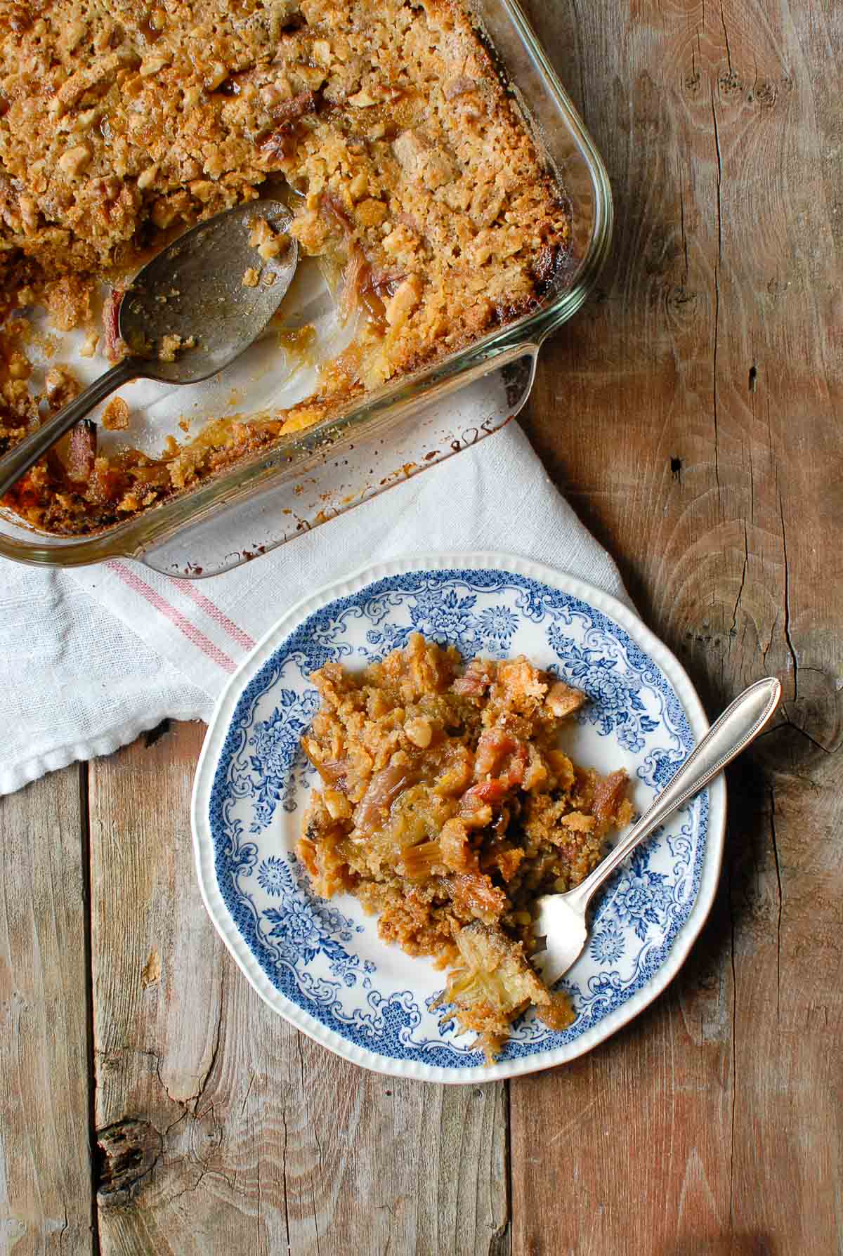 Rhubarb Crisp in a baking pan with serving overhead 