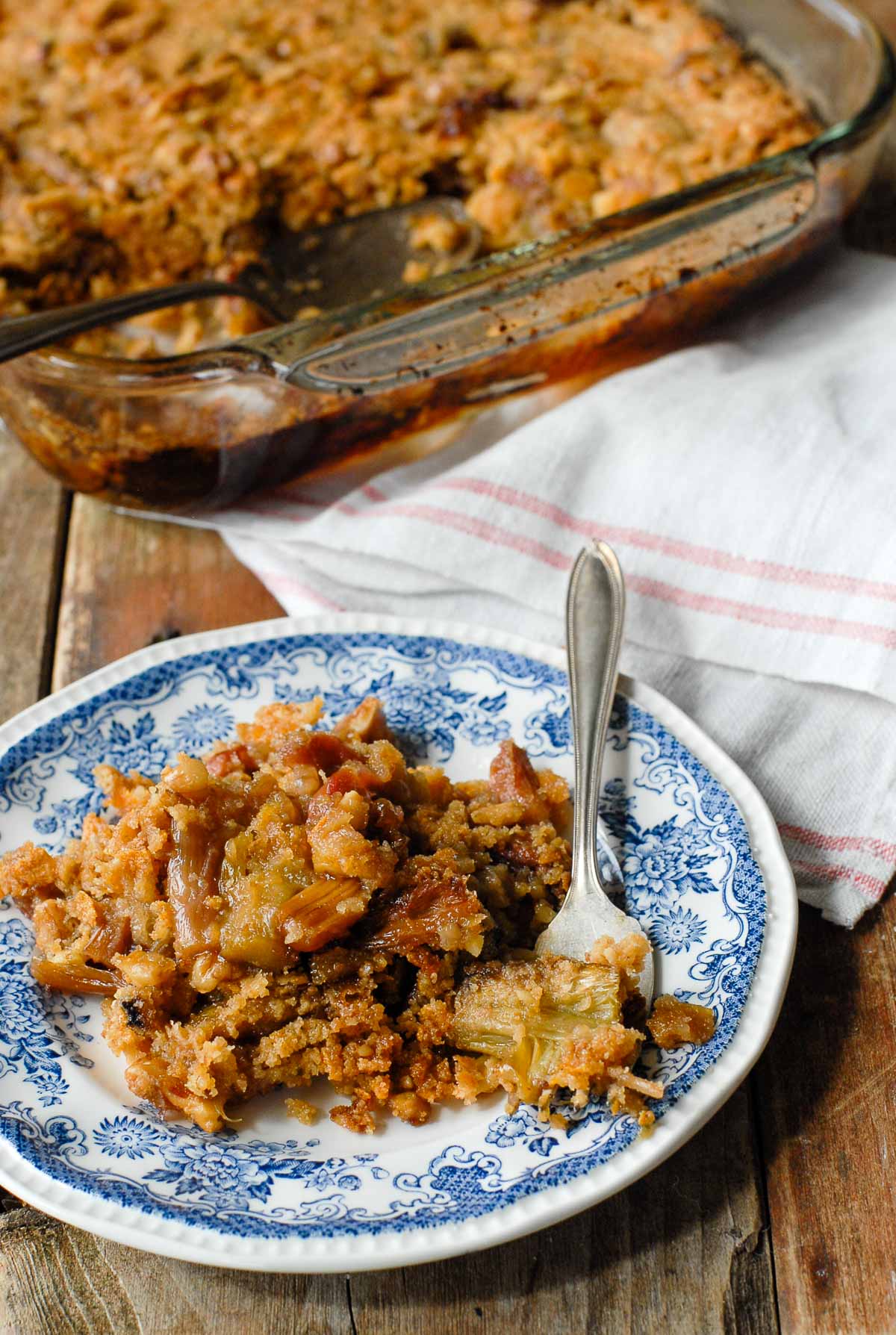 Rhubarb Crisp in a baking pan with serving spoon 