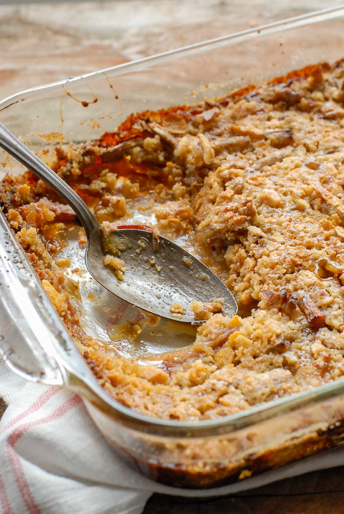 Rhubarb Crisp in a baking pan with serving spoon