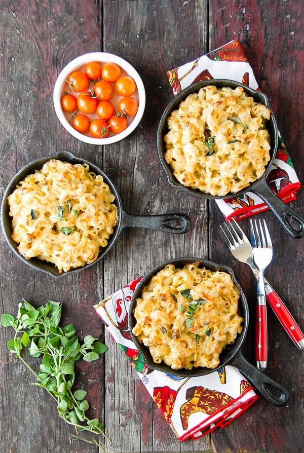 Creamy Roasted Green Chile Chicken Mac and Cheese in skillets with forks