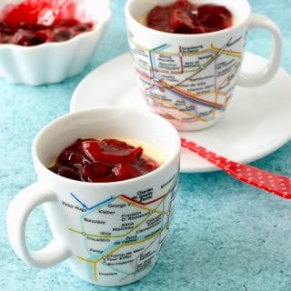 No Bake Vanilla Bean Pots de Creme with fresh Cherry Sauce in French Metro cups  closeup