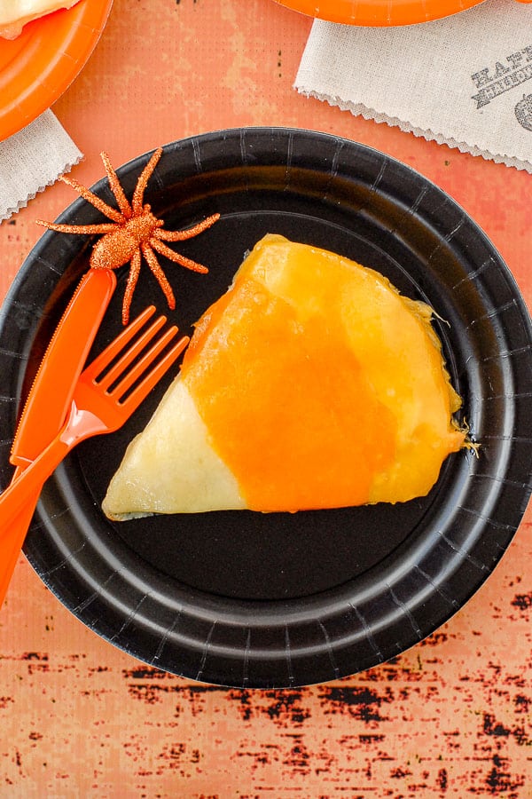 close up of Candy Corn Chicken Quesadilla on black plate