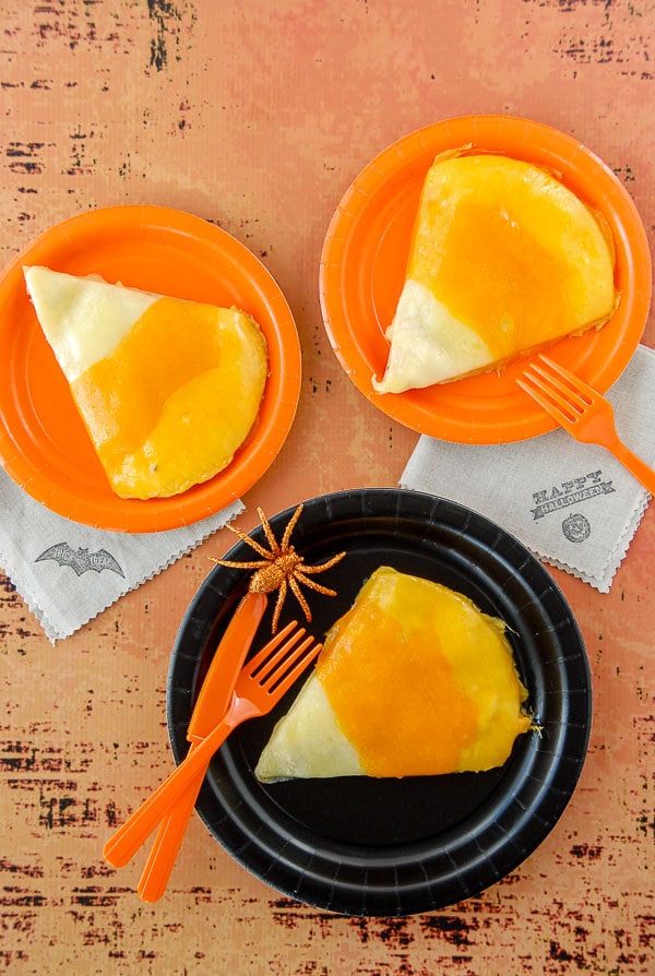 Three Candy Corn chicken quesadillas on halloween plates