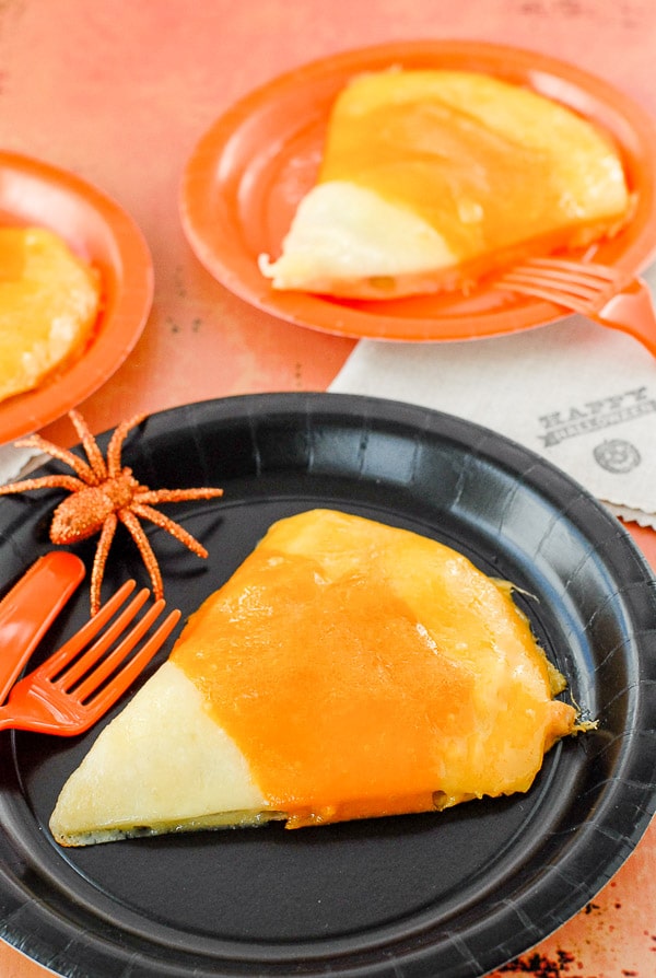 Candy Corn Chicken Cheese Quesadilla for Halloween on black plate
