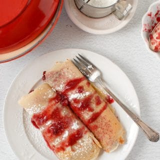 Fall-Spiced Pear and Cherry Crepes on white plate