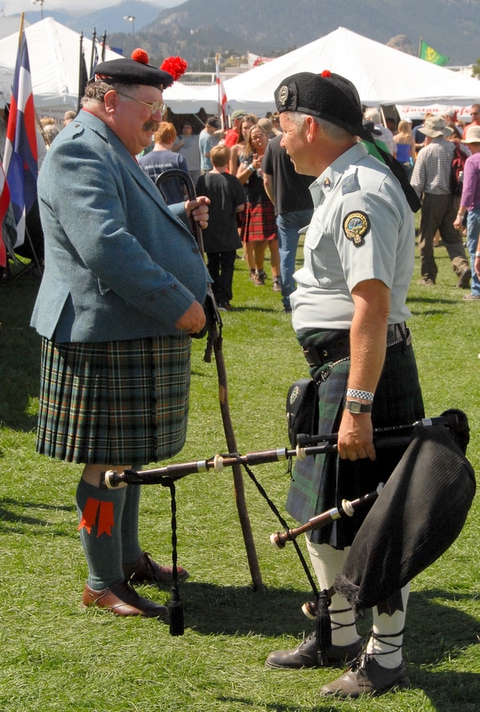 men in kilts chatting