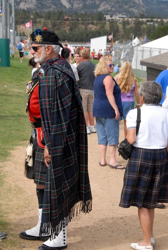 man in kilt and cape at Scottish festival