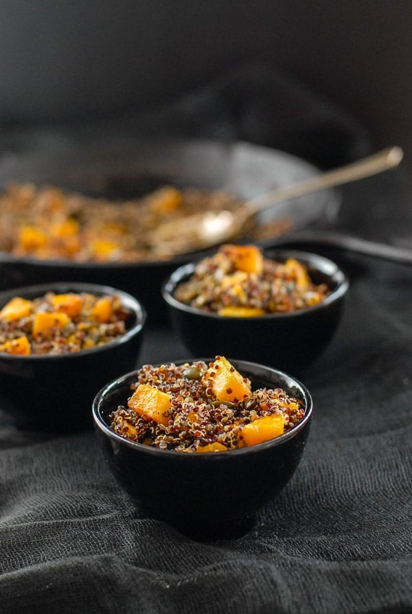 bowls of black quinoa with sage brown butter sauce
