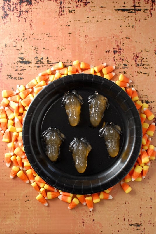 Glowing Candy Corn Vodka Jello Shots shaped like frogs