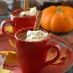 Pumpkin Mexican Hot Chocolate whipped cream and cinnamon stick