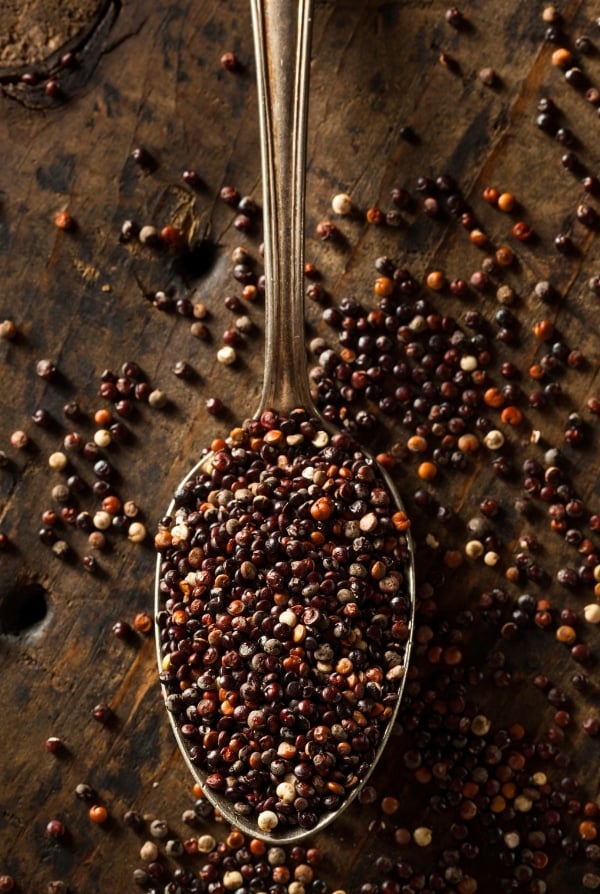 vintage spoon of raw black quinoa