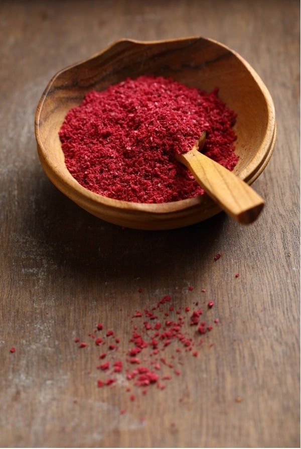 Ground Sumac in wooden bowl