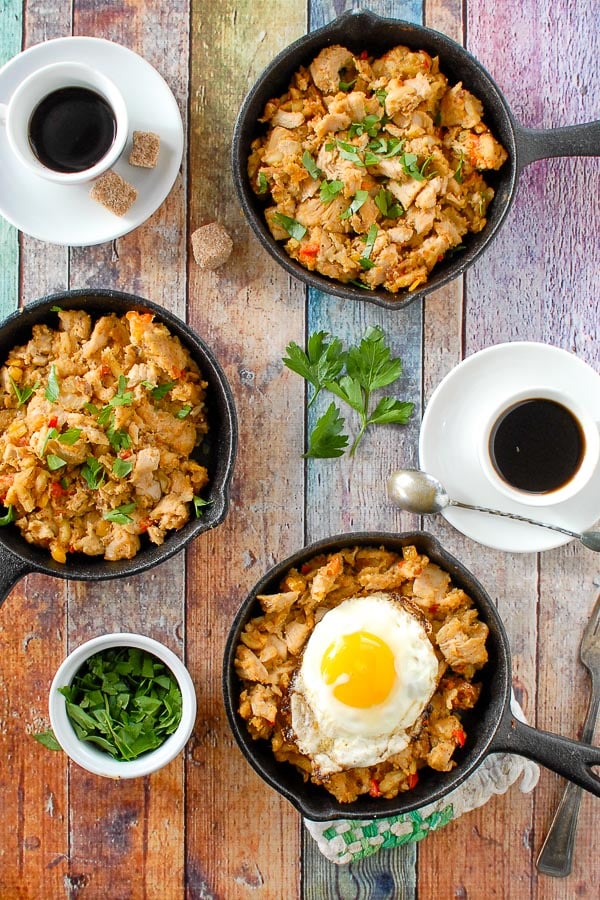 three skillets of holiday turkey hash with espresso cups