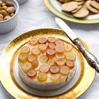 Baked Brie with Pink Champagne Jelly, Red Grapes and Marcona Almonds