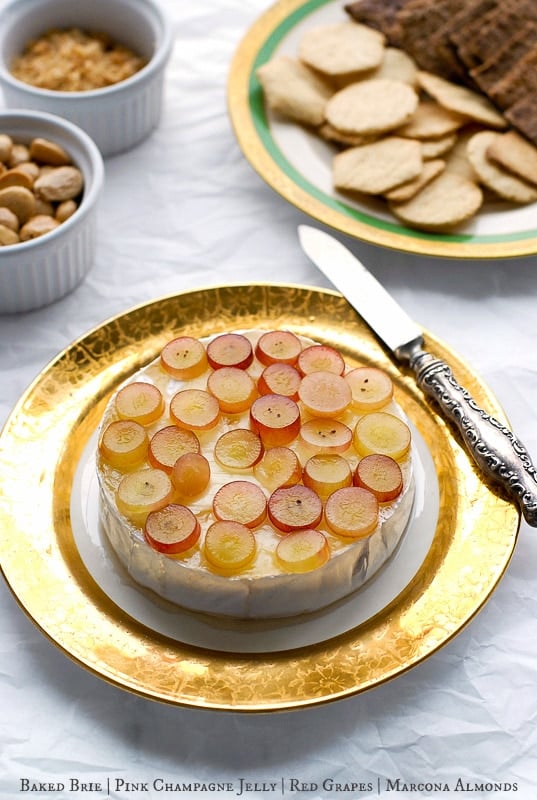 Baked Brie with Pink Champagne Jelly, Red Grapes and Marcona Almonds