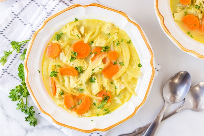 bowl of Coconut Curry Turkey Rice Soup with spoons