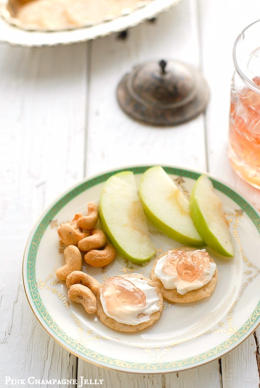 Homemade Pink Champagne Jelly recipe with apple slices and cream cheese