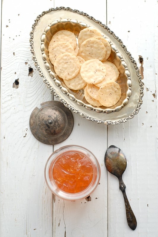 Homemade Pink Champagne Jelly with crackers in a silver bowl