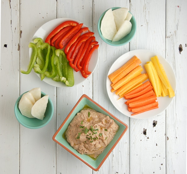 Smoky Black-Eyed Pea Bacon Hummus with cut vegetables