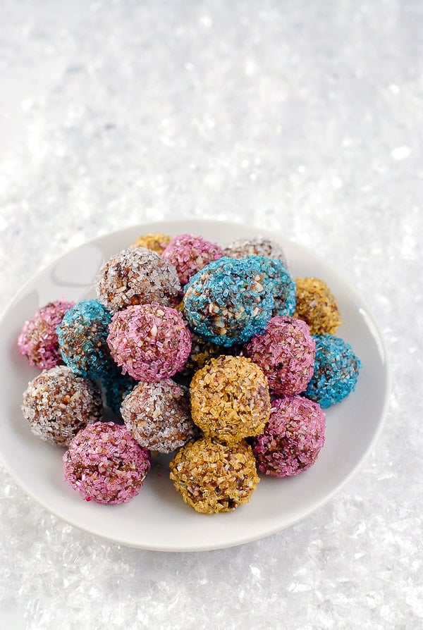 Sparkling Sugar Plums on a white plate in the snow