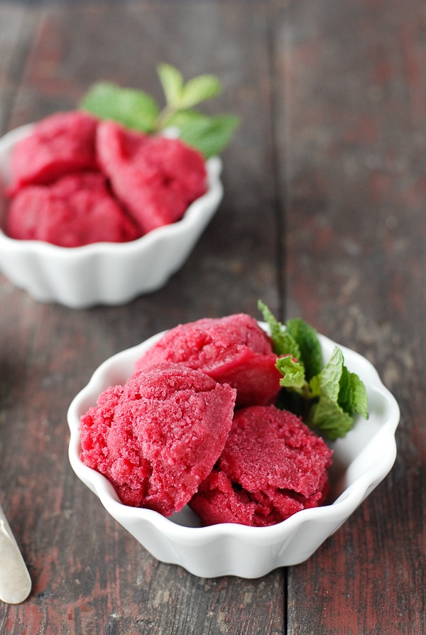 beet sorbet in white fluted bowls