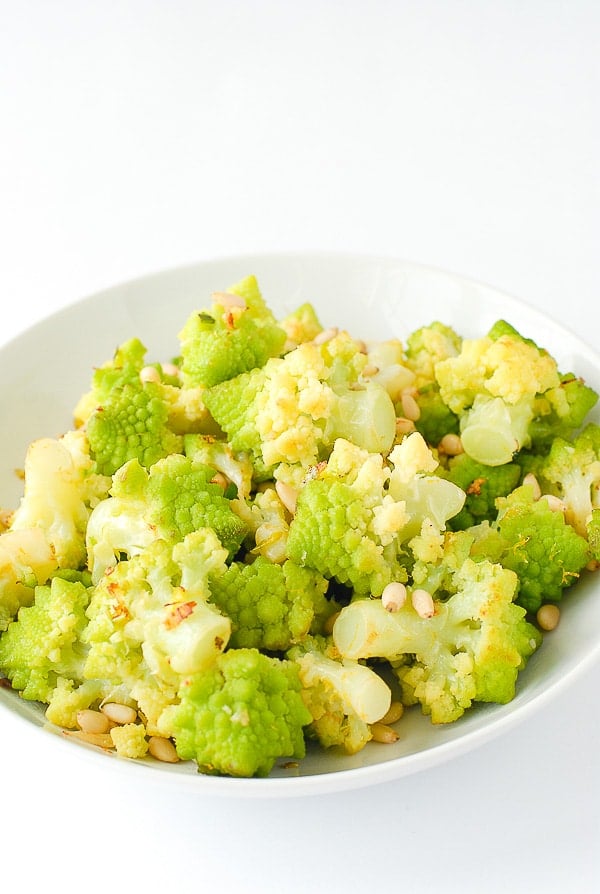 Lemony Romanesco with Pine Nuts in a white bowl