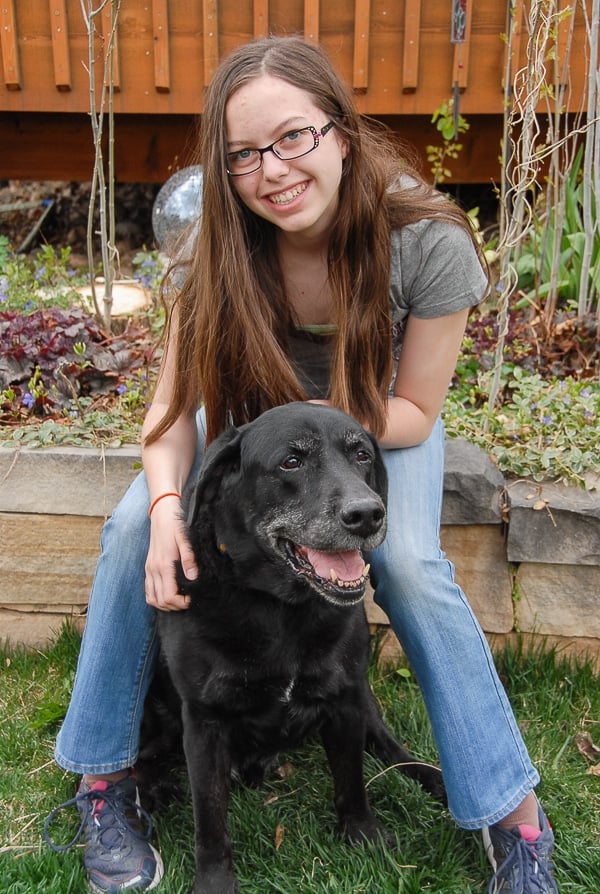 A person holding a dog