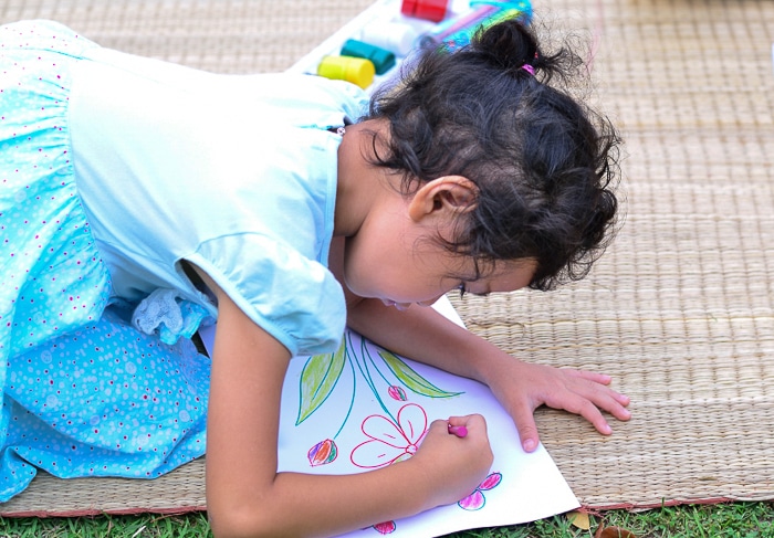 Young Student Drawing a Garden 