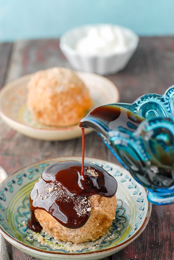 churro fried ice cream with chocolate syrup on top