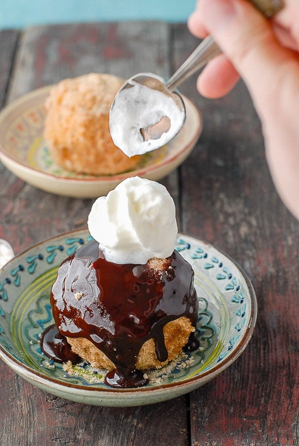 churro fried ice cream with chocolate syrup and whipping cream 