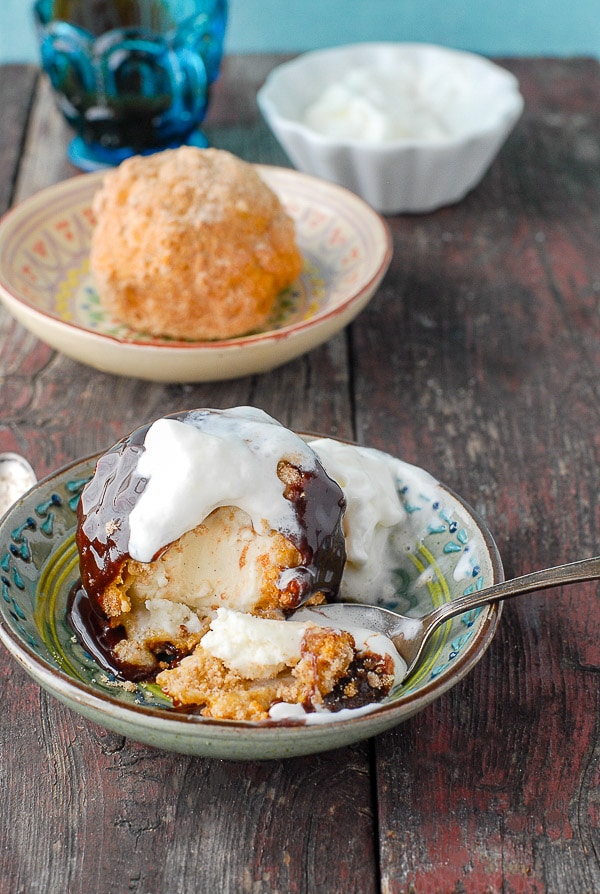 churro fried ice cream with chocolate syrup and whipping cream 