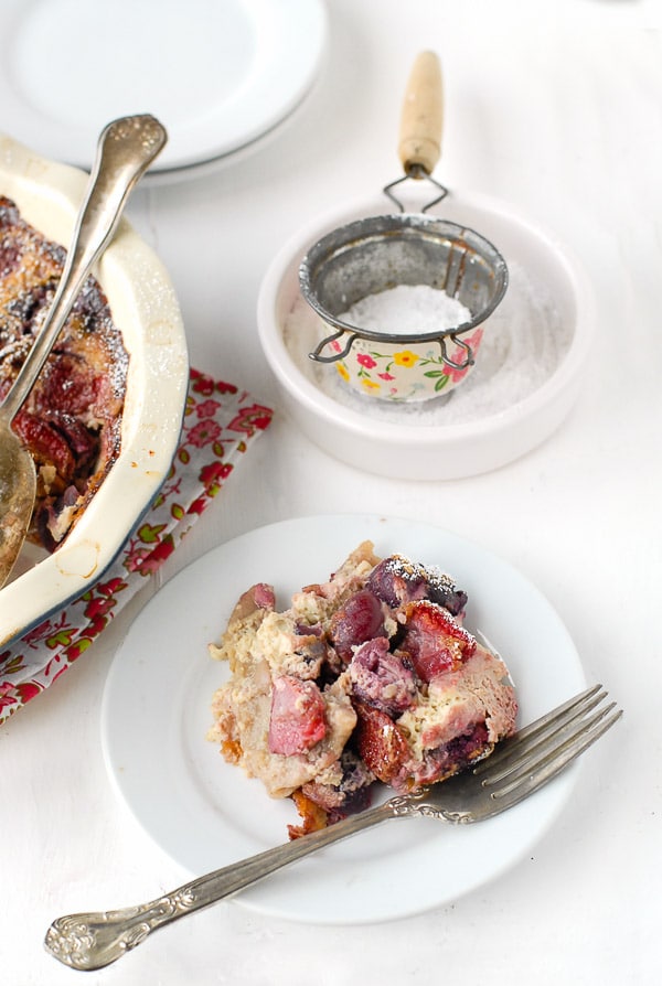 Single serving of Cherry Strawberry Claufoutis on a small white plate 