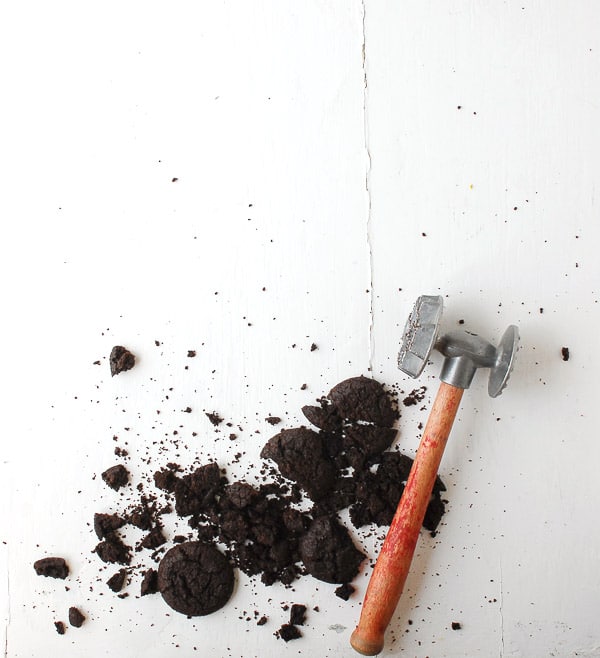 Broken Chocolate Cookies with a vintage meat mallet 