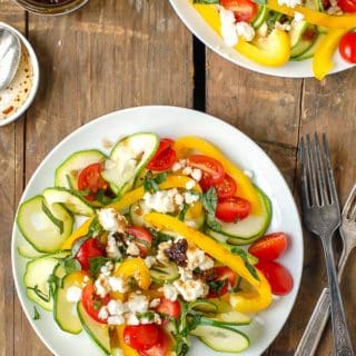 plate of Mediterranean Salad with zucchini ribbons and sun-dried tomato balsamic vinaigrette