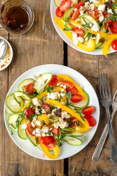 plate of Mediterranean Salad with zucchini ribbons and sun-dried tomato balsamic vinaigrette