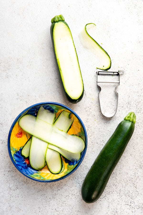 Zucchini ribbons made with a vegetable peeler in a bowl